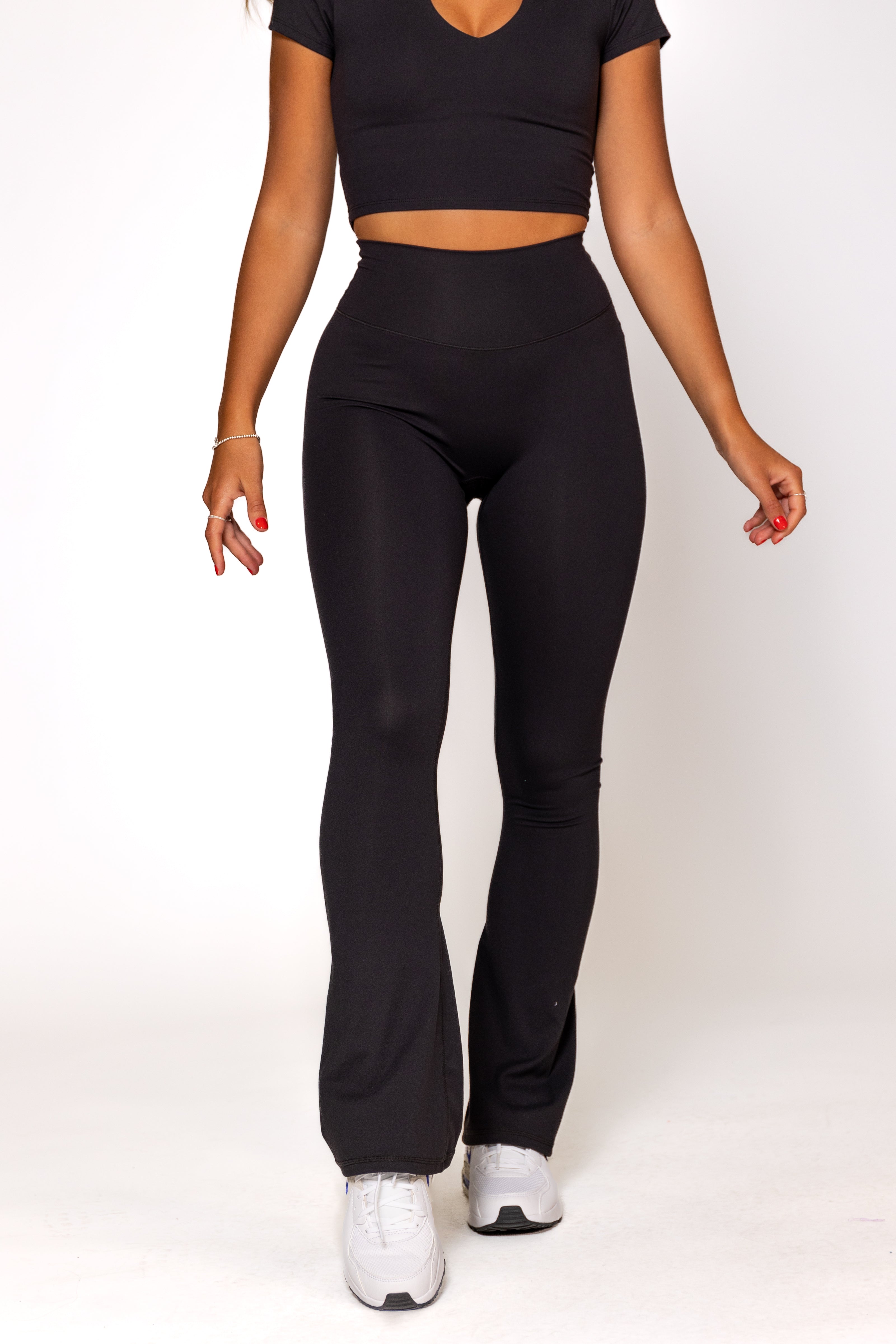 https://www.ptula.com/cdn/shop/files/flare_legging_black_short_inseam_ptula_002_3559a9a2-7cf8-457d-ab7b-819e6a61d286.jpg?v=1709233380